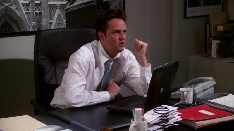 Apple PowerBook Black Laptop Used by Matthew Perry (Chandler Bing) in Friends Season 7 Episode 24 “The One With Monica and Chandler's Wedding Part 2” (2001)