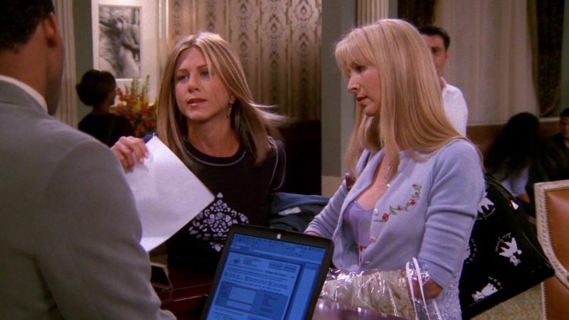Apple PowerBook Black Notebook in Friends Season 8 Episode 2 “The One With the Red Sweater” (2001)