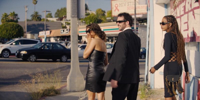 Saint Laurent (YSL) black woven fabric fringe passementerie crossbody bag in I Love LA S01E06 “Game Night” (2025)